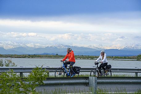 Cyclists and Grado Lagoon.