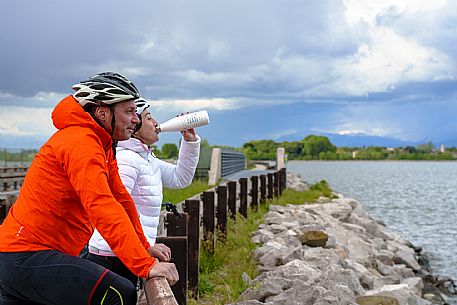 Cyclists and Grado Lagoon.