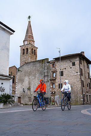 Cyclists in Grado old town.