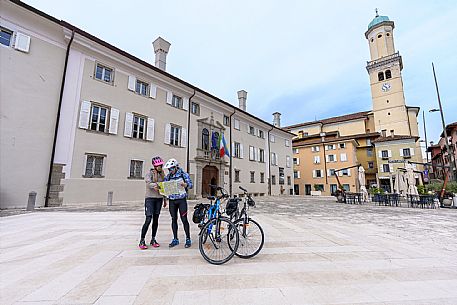 Cyclists in XXIV Maggio square in Cormons.