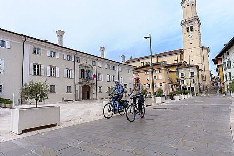 Cyclists in XXIV Maggio square in Cormons.