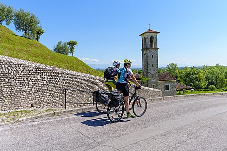 Cyclists near the Ancona church in Spilimbergo