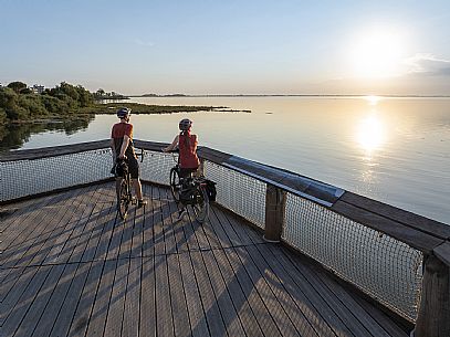 Cyclists looking at the sunset.