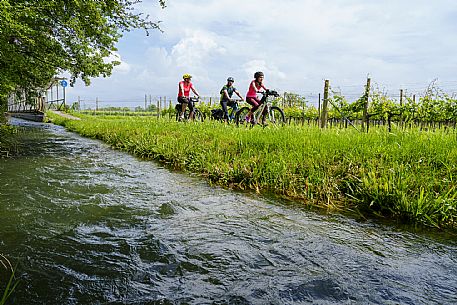 Cyclists family on the ditches cycle path