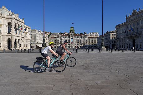 Cyclists in Unità d'Italia square