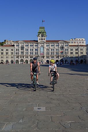 Cyclists in Unità d'Italia square