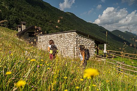 Friends trekking in the Julian Prealps Park, from Coot hut to Canin hut. Julian Prealps Natural Park. MABUNESCO