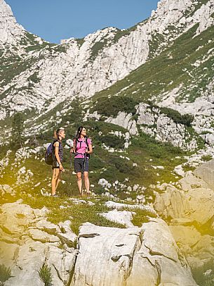 Trekking from the Celsio Gilberti Refuge, along the Bila Peč botanical path and further along the path that leads to the Marussic bivouac, on the suggestive karst plateau of Foran dal Mus. Prealpi Giulie Natural Park, MAB Unesco.