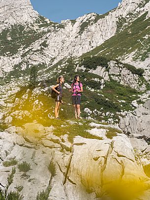 Trekking from the Celsio Gilberti Refuge, along the Bila Peč botanical path and further along the path that leads to the Marussic bivouac, on the suggestive karst plateau of Foran dal Mus. Prealpi Giulie Natural Park, MAB Unesco.