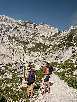 Trekking from the Celsio Gilberti Refuge, along the Bila Peč botanical path and further along the path that leads to the Marussic bivouac, on the suggestive karst plateau of Foran dal Mus. Prealpi Giulie Natural Park, MAB Unesco.