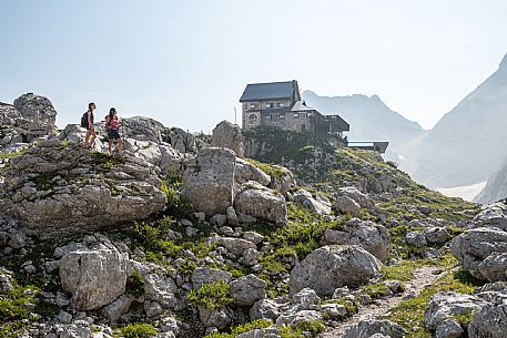 Trekking from the Celsio Gilberti Refuge, along the Bila Peč botanical path and further along the path that leads to the Marussic bivouac, on the suggestive karst plateau of Foran dal Mus. Prealpi Giulie Natural Park, MAB Unesco.