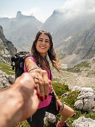 Trekking from the Celsio Gilberti Refuge, along the Bila Peč botanical path and further along the path that leads to the Marussic bivouac, on the suggestive karst plateau of Foran dal Mus. Prealpi Giulie Natural Park, MAB Unesco.