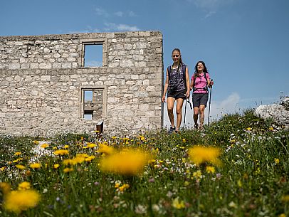 Trekking from the Celsio Gilberti Refuge, along the Bila Peč botanical path and further along the path that leads to the Marussic bivouac, on the suggestive karst plateau of Foran dal Mus. Prealpi Giulie Natural Park, MAB Unesco.