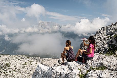 Trekking from the Celsio Gilberti Refuge, along the Bila Peč botanical path and further along the path that leads to the Marussic bivouac, on the suggestive karst plateau of Foran dal Mus. Prealpi Giulie Natural Park, MAB Unesco.