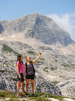 Trekking from the Celsio Gilberti Refuge, along the Bila Peč botanical path and further along the path that leads to the Marussic bivouac, on the suggestive karst plateau of Foran dal Mus. Prealpi Giulie Natural Park, MAB Unesco.