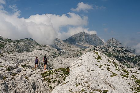 Trekking from the Celsio Gilberti Refuge, along the Bila Peč botanical path and further along the path that leads to the Marussic bivouac, on the suggestive karst plateau of Foran dal Mus. Prealpi Giulie Natural Park, MAB Unesco.