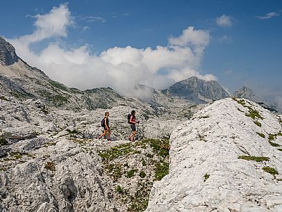 Trekking from the Celsio Gilberti Refuge, along the Bila Peč botanical path and further along the path that leads to the Marussic bivouac, on the suggestive karst plateau of Foran dal Mus. Prealpi Giulie Natural Park, MAB Unesco.