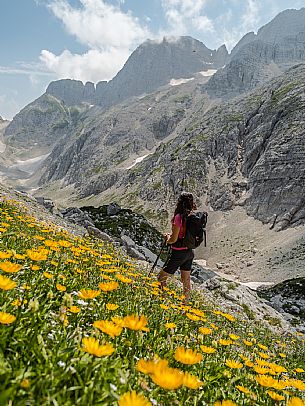 Trekking from the Celsio Gilberti Refuge, along the Bila Peč botanical path and further along the path that leads to the Marussic bivouac, on the suggestive karst plateau of Foran dal Mus. Prealpi Giulie Natural Park, MAB Unesco.