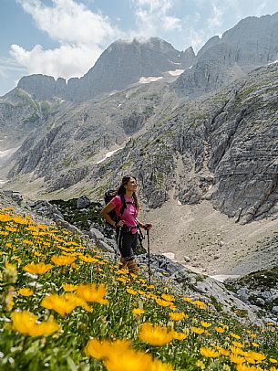 Trekking from the Celsio Gilberti Refuge, along the Bila Peč botanical path and further along the path that leads to the Marussic bivouac, on the suggestive karst plateau of Foran dal Mus. Prealpi Giulie Natural Park, MAB Unesco.