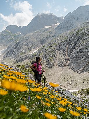 Trekking from the Celsio Gilberti Refuge, along the Bila Peč botanical path and further along the path that leads to the Marussic bivouac, on the suggestive karst plateau of Foran dal Mus. Prealpi Giulie Natural Park, MAB Unesco.