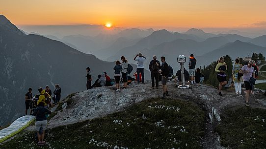 Lift up to Monte Santo di Lussari, enjoying the summer night opening of the telecabine. To enjoy the beautiful view of the Julian Mountains at sunset and the village lit up at night.