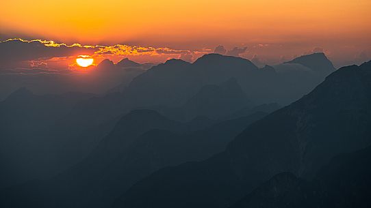 Lift up to Monte Santo di Lussari, enjoying the summer night opening of the telecabine. To enjoy the beautiful view of the Julian Mountains at sunset and the village lit up at night.