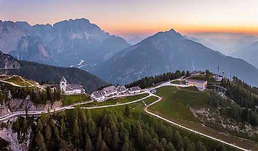 Lift up to Monte Santo di Lussari, enjoying the summer night opening of the telecabine. To enjoy the beautiful view of the Julian Mountains at sunset and the village lit up at night.