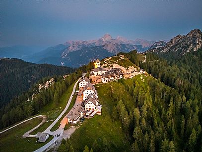 Lift up to Monte Santo di Lussari, enjoying the summer night opening of the telecabine. To enjoy the beautiful view of the Julian Mountains at sunset and the village lit up at night.