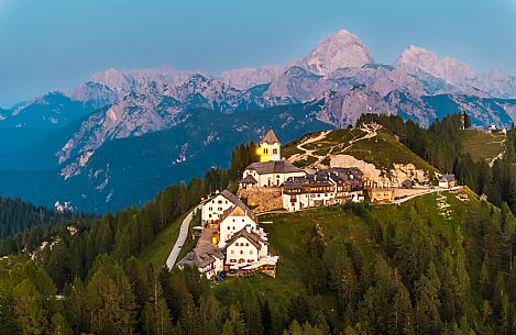 Lift up to Monte Santo di Lussari, enjoying the summer night opening of the telecabine. To enjoy the beautiful view of the Julian Mountains at sunset and the village lit up at night.