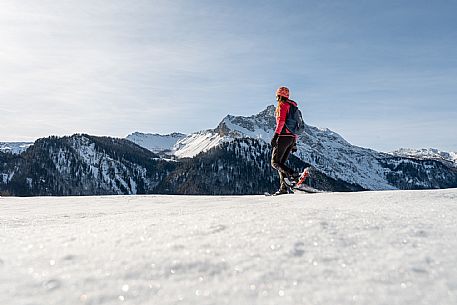 Snowshoe walk in Sauris di Sopra, with the iconic Bivera mountain in the background