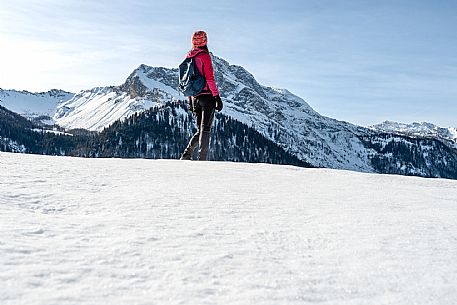 Snowshoe walk in Sauris di Sopra, with the iconic Bivera mountain in the background