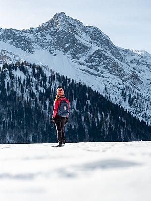 Snowshoe walk in Sauris di Sopra, with the iconic Bivera mountain in the background