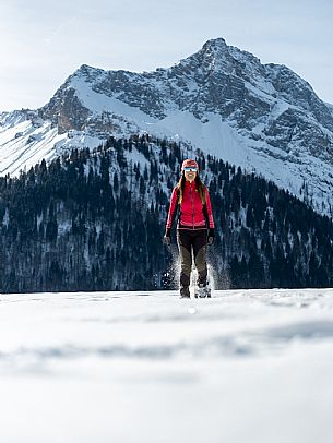 Snowshoe walk in Sauris di Sopra, with the iconic Bivera mountain in the background