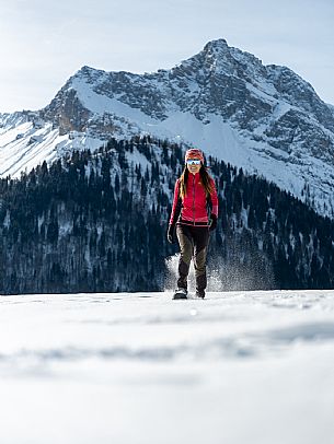 Snowshoe walk in Sauris di Sopra, with the iconic Bivera mountain in the background