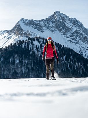 Snowshoe walk in Sauris di Sopra, with the iconic Bivera mountain in the background