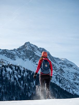 Snowshoe walk in Sauris di Sopra, with the iconic Bivera mountain in the background