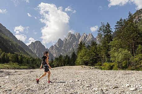 Walking along the fox and bear path in Val Gleris with the majestic Seven Peaks Group in the background, Pontebba Walking along the fox and bear path in Val Gleris with the majestic Seven Peaks Group in the background, Pontebba