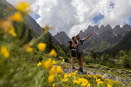 Walking along the fox and bear path in Val Gleris with the majestic Seven Peaks Group in the background, Pontebba Walking along the fox and bear path in Val Gleris with the majestic Seven Peaks Group in the background, Pontebba