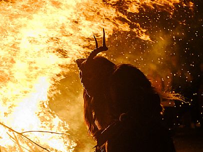 Krampus and St Nicholas, the tradition of 5 December in Tarvisio. Here in the mining village of Cave del Predil Krampus and St Nicholas, the tradition of 5 December in Tarvisio. Here in the mining village of Cave del Predil